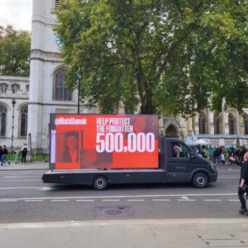 A van with a billboard on highlighting the Forgotten 500K campaign