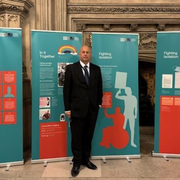 Four roller banners with information about the Forgotten 500K campaign in the Houses of Parliament